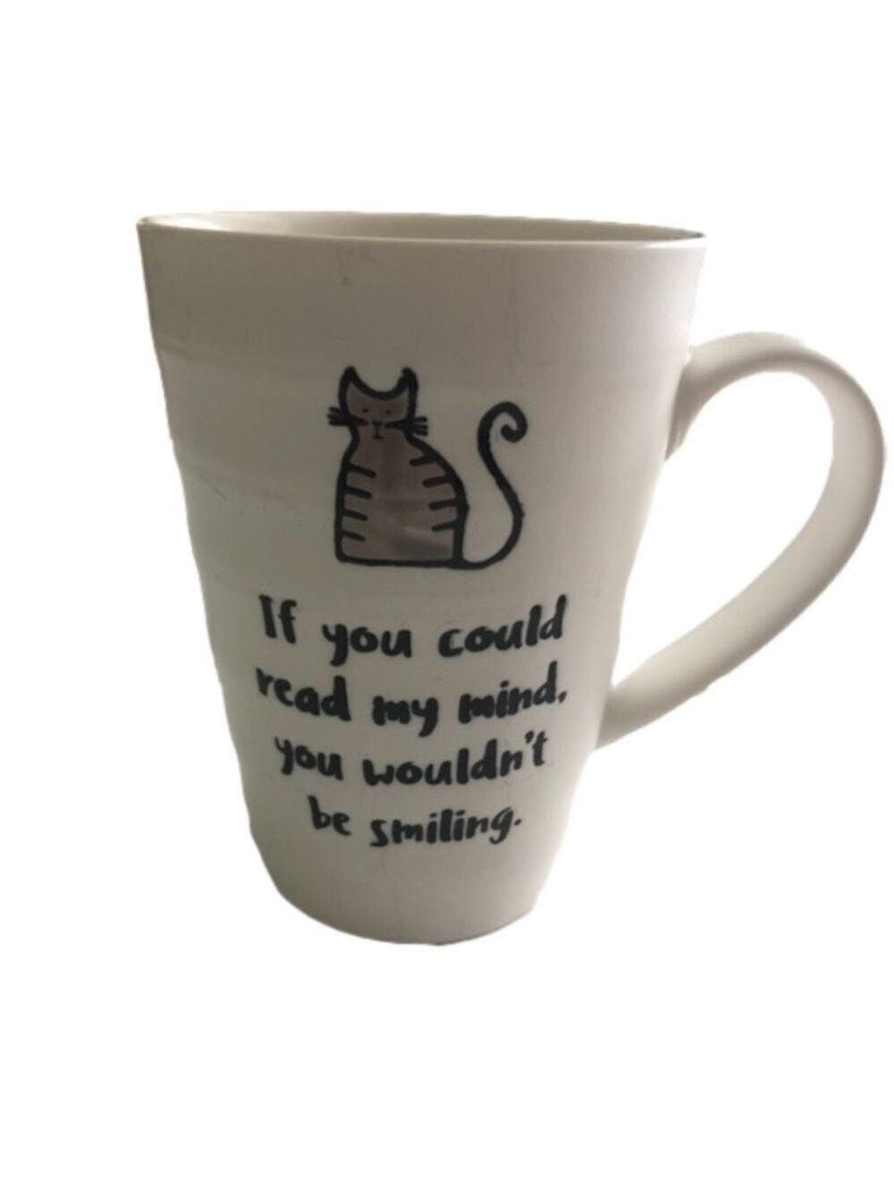 Coffee mug with mischievous cat